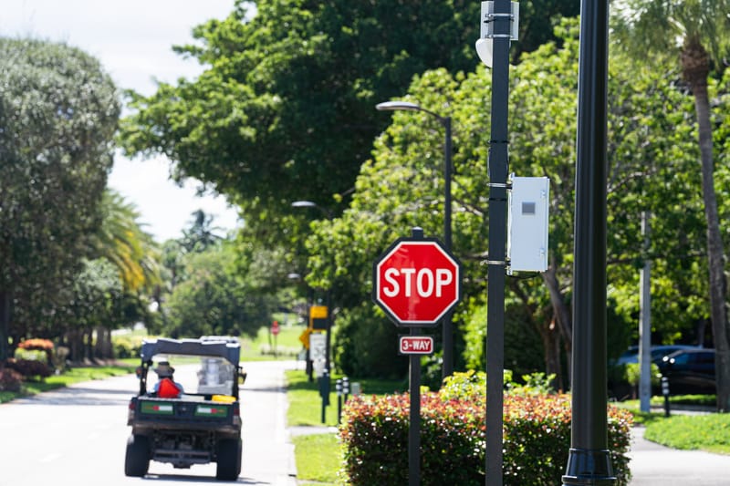 Camera installed beside a community stop sign